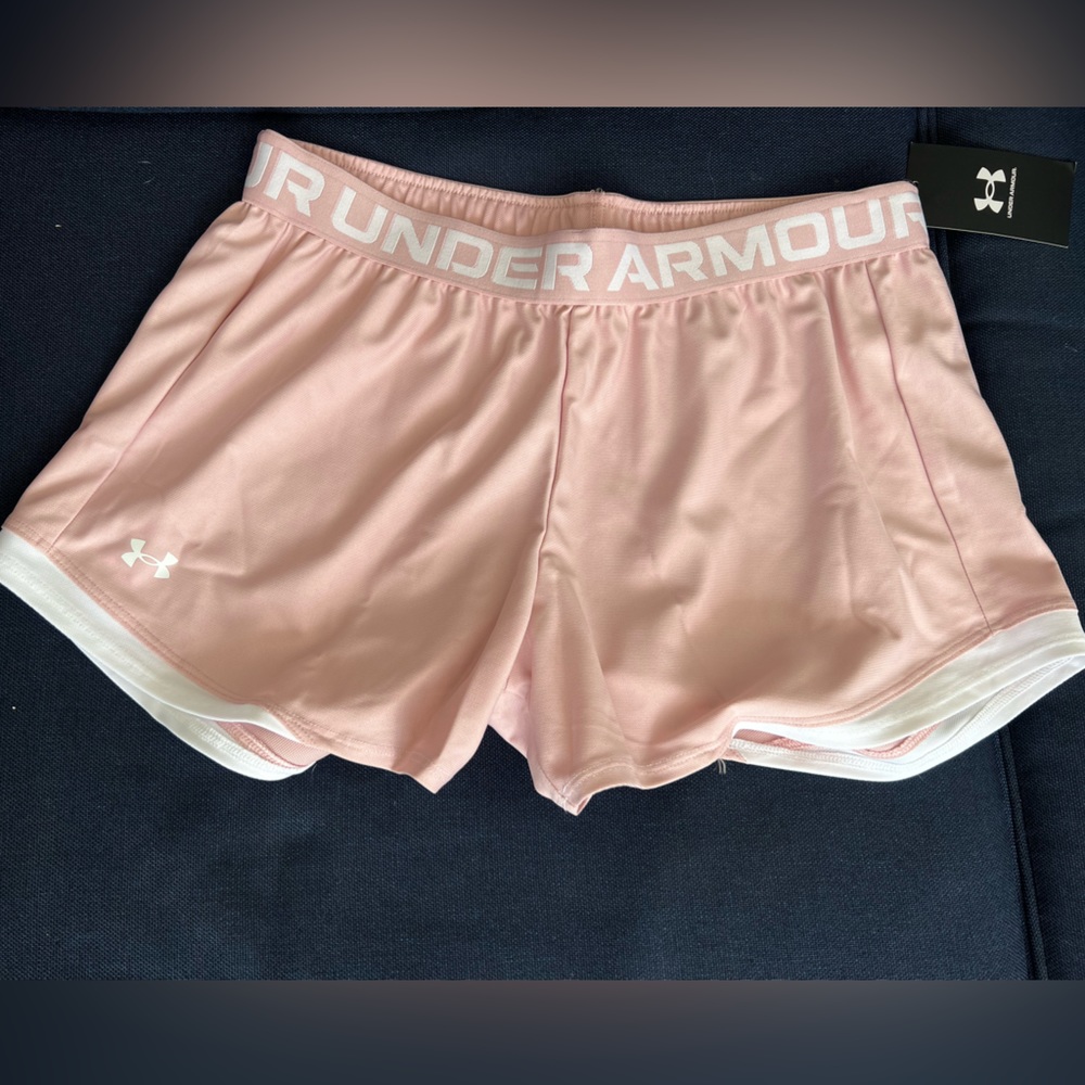 Retro pink and white Under Armour woman’s play up 2.0 shorts.